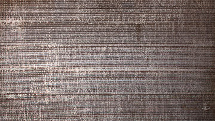 Snímek návarové vrstvy karbidu znázorňující svarové housenky