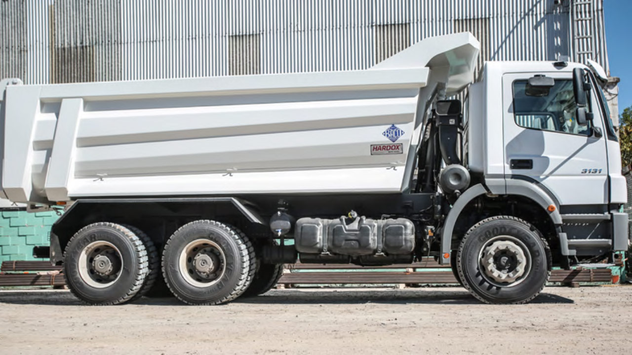 A white tipper truck in Hardox 500 Tuf with a conical side panel design