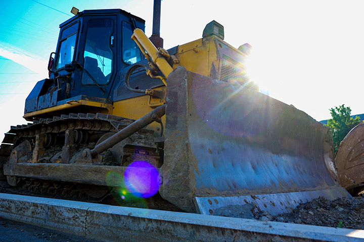 Enormous bulldozer against a blue sky