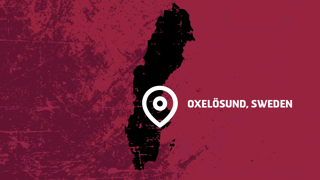 Image of Sweden marked by the city of Oxelösund, against the bold Hardox® wear plate background color red. 