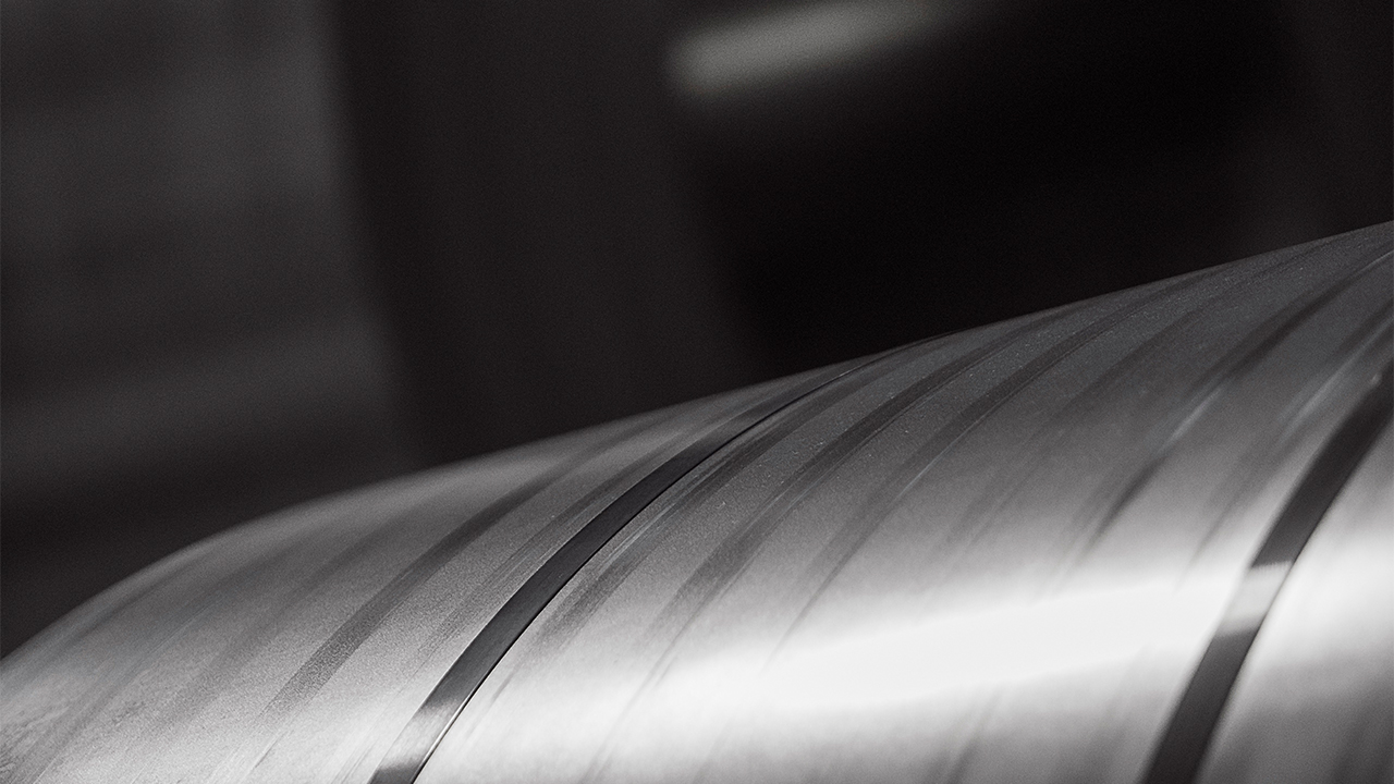 A photo of a shiny steel coil.