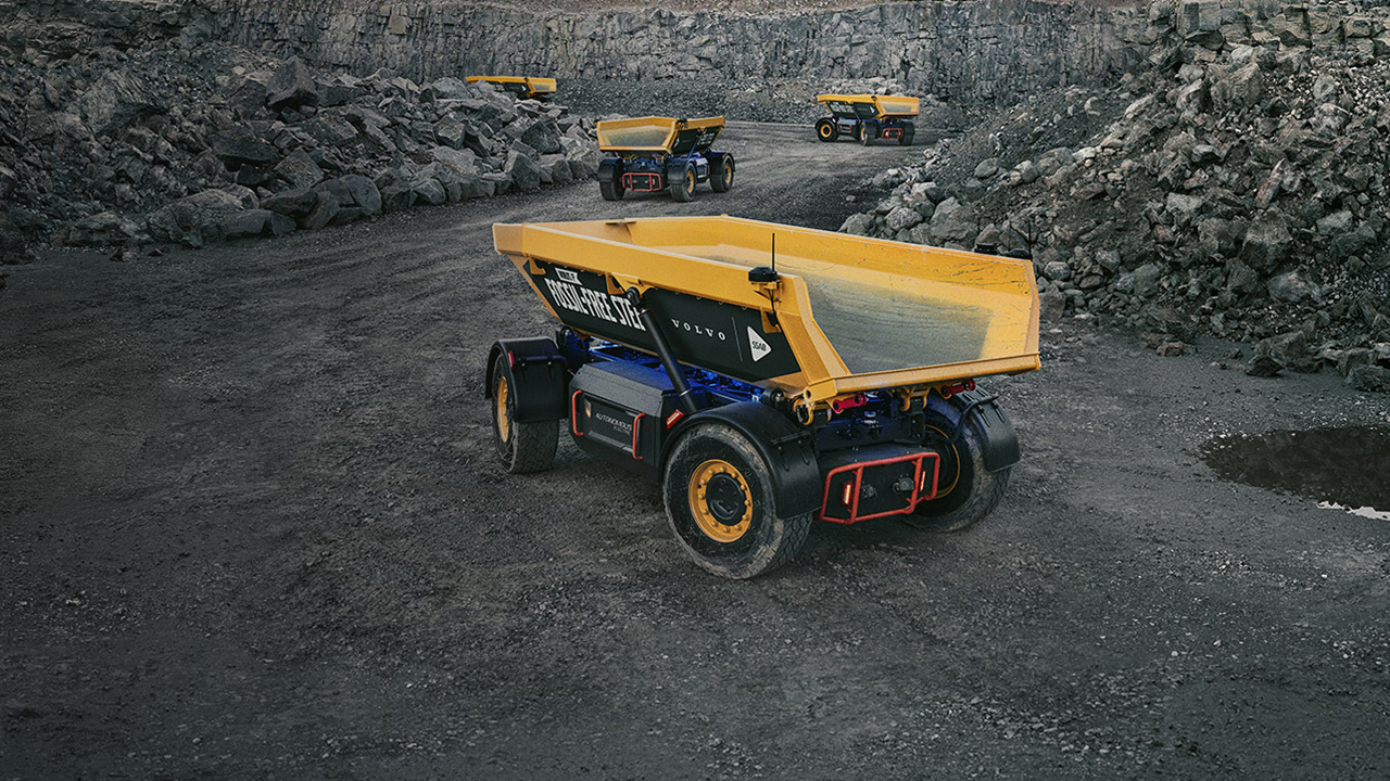 A yellow loader truck in a quarry. 