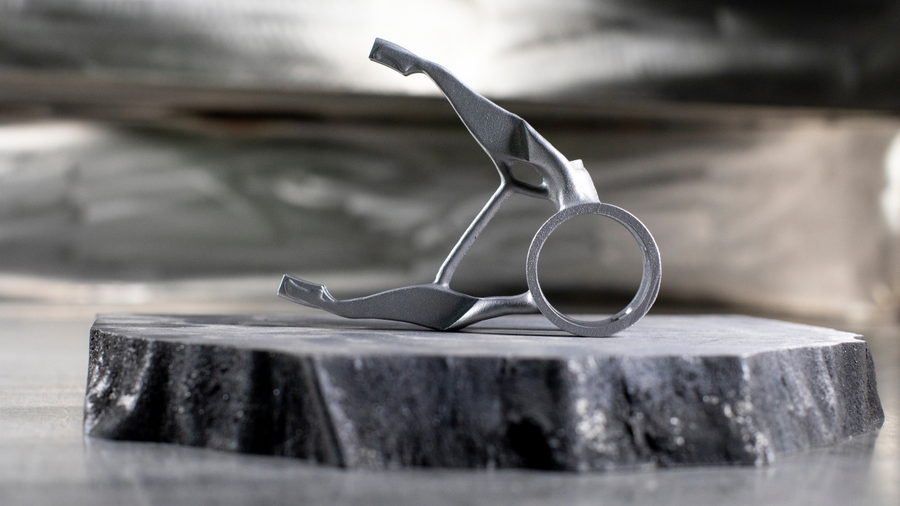 A photo of a complex 3D printed object in steel